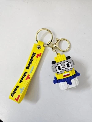 Llavero bebé Building Block - Mini figura bloque con correa amarilla Foto 1 de 4