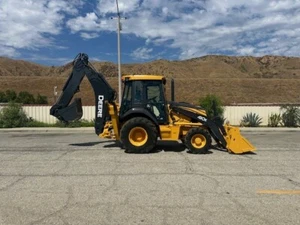 JOHN DEERE 410-K 4X4 LOADED WITH AC PILOT CONTROLS, POWER SHIFT, EX CALIF CITY - Picture 1 of 16
