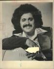 Press Photo Musician Freddie Fender leans on guitar smiling in portrait