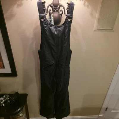 Pantalones con tirantes Obermeyer aislados para esquí nieve medianos negros impermeables para hombre equipo de invierno Foto 1 de 4