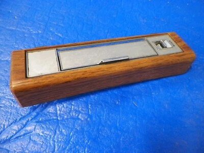 Cadillac 1980-1984 sedán DeVille Brougham LR cenicero trasero izquierdo placa de interruptor tracción trasera Foto 1 de 4