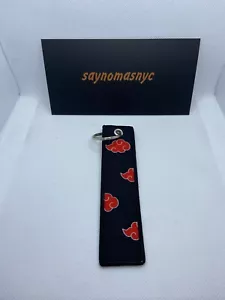 Schlüsselanhänger Naruto Anime Manga rot Akatsuki Wolke bestickt Jet-Tag - Bild 1 von 1