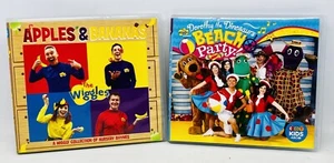 2 Wiggles CD’s - Apples & Bananas & Dorothy The Dinosaurs Beach Party - Picture 1 of 2
