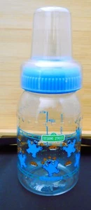 Sesame Street 1986 Vtg Baby Bottle-Cherubs-4 oz Plastic-Cap-Blue Lid-No Nipple - Picture 1 of 8