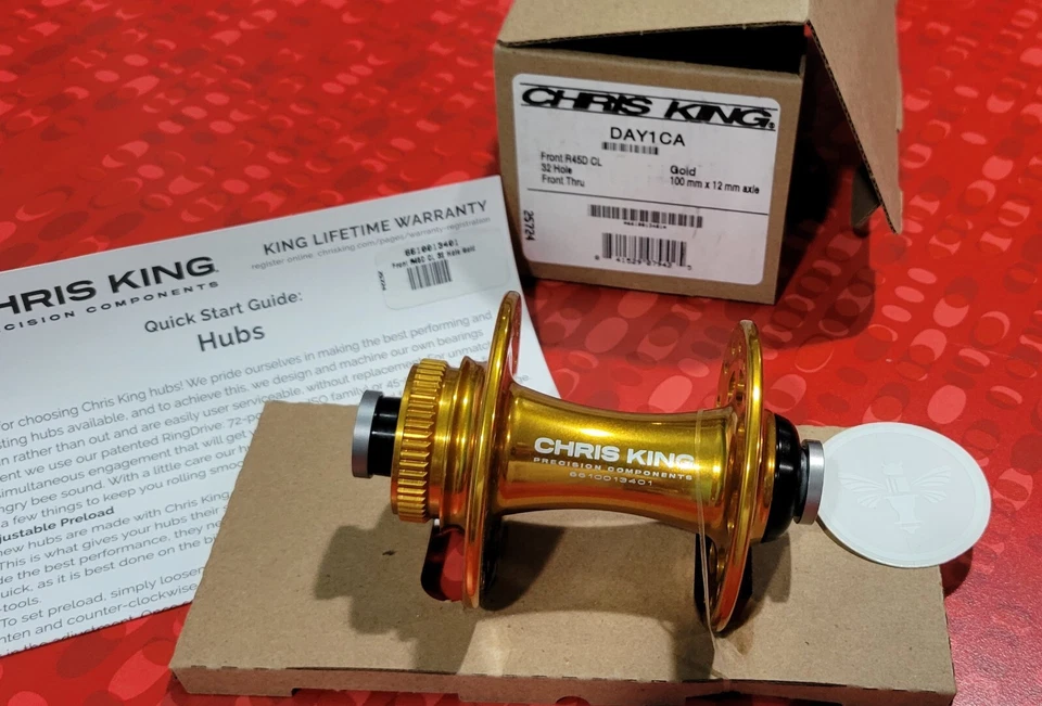 全新 Chris King R45D 中心锁盘前置集线器 - 32 小时 - 金色 - 100x12 毫米 — 第 1/3 张图片