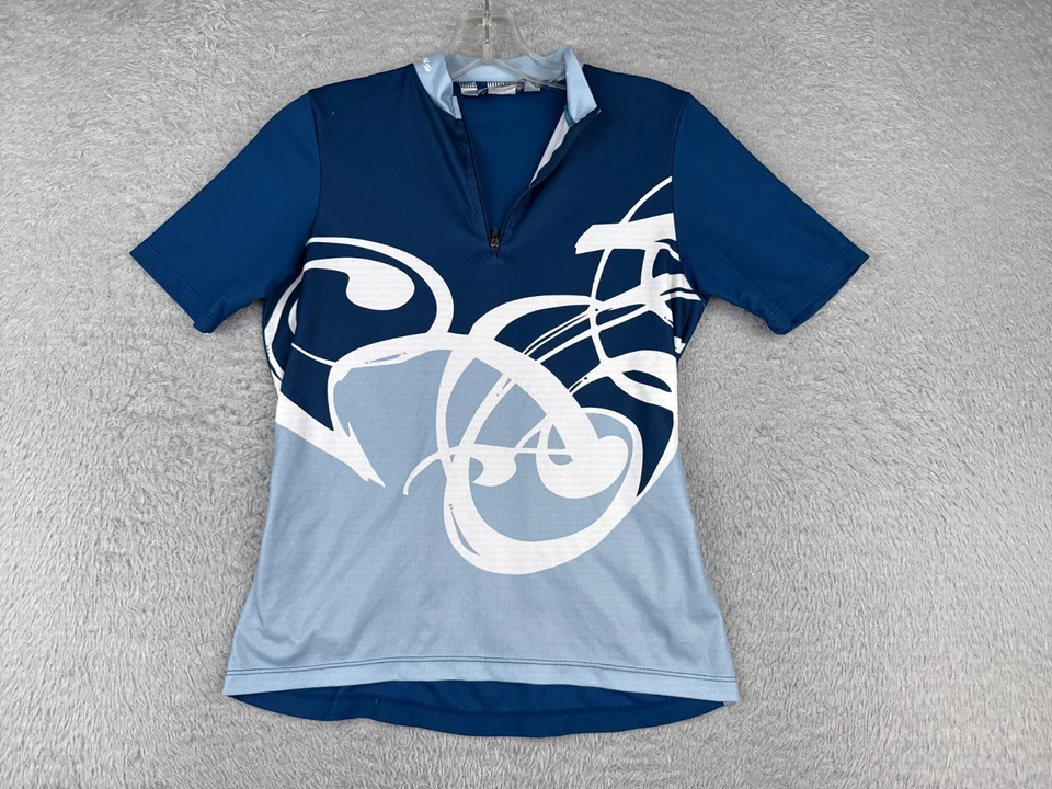 Camiseta de ciclismo Sugoi para niñas extra grande azul 1/4 cremallera manga corta 100 % poliéster Foto 1 de 4