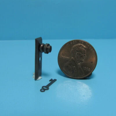 Dollhouse Miniature Bronze Metal Door Knob with Key Plate and Key CLA05526 - Image 1 of 2