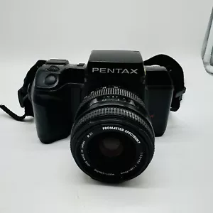 Cámara fotográfica Pentax SF10 con lente Promaster Spectrum 7 28-70 mm - Imagen 1 de 13
