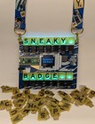 Sneaky Badge DEF CON 31 badgelife badge from Defcon 31, with letter pack.