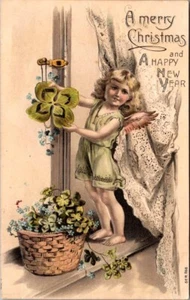 A MERRY CHRISTMAS and A Happy New Year ANGEL WITH FLOWERS embossed Postcard - Picture 1 of 2