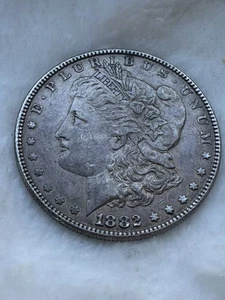 1882 Morgan Silver Dollar - Toned - INV#7691 - Picture 1 of 2