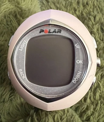 Reloj monitor de ritmo cardíaco para mujer Polar F6 rosa coral tono plata WR50M sin cable Foto 1 de 4