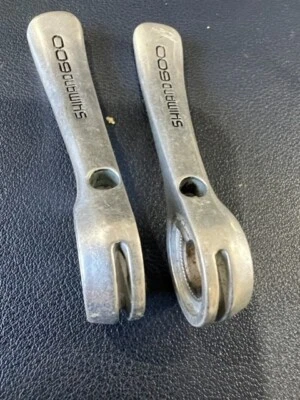 ! PALANCA DE CAMBIOS TUBO DESCENDENTE SHIMANO 600 NO INCLUYE COMPONENTES INTERNOS SOLO PALANCAS Foto 1 de 3