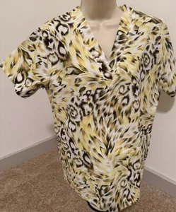 DELTA WOMENS SIZE XSMALL SCRUB TOP CHEETAH PRINT NEW WITH TAGS - Picture 1 of 1