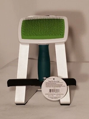 Cepillo y alfombrilla resbaladiza para perros para abrigos medianos a largos Foto 1 de 3