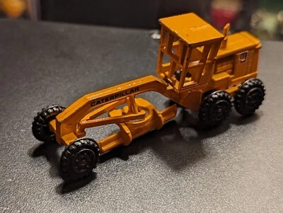 RUGGED ROAD GRADER AZTEC YELLOW CATERPILLAR BRAND WHEELS ROLL PERFECTLY - Image 1 of 4