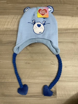 NUEVO Care Bears Sombrero de Laponia Oso Gruñón Azul Forrado de Vellón Corazón Trenzado Invierno Foto 1 de 4