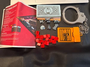 MONOPOLY CHEATERS EDITION 6 Tokens, Handcuff, Money, Houses REPLACEMENT PARTS - Picture 1 of 3