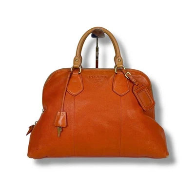 Подлинная кожаная сумка-тоут PRADA Vittero Dyno оранжевая с подвеской и замком - Изображение 1 из 4