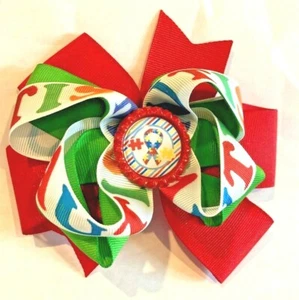 Beautiful Red Puzzle Piece Autism Inspired Hair Bow for girls. - Imagen 1 de 2