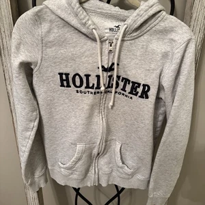 Sudadera con capucha gris con cremallera Hollister XS para mujer logotipo sur de California - Imagen 1 de 7