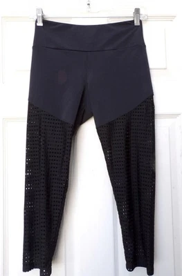 PANTALONES DEPORTIVOS ONZIE FLOW RECORTADOS TIRO ALTO NEGRO MALLA PIERNA Talla S-M Foto 1 de 4