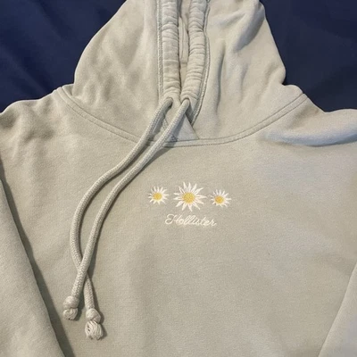 HOLLISTER Mujer L Corta Sudadera con Capucha Margarita Floral Bordado Pullover Sudadera Azul Foto 1 de 4