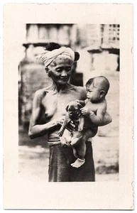 1931 Naked Topless Old Bali Woman Holding Baby & Dog - REAL PHOTO Postcard - Picture 1 of 2