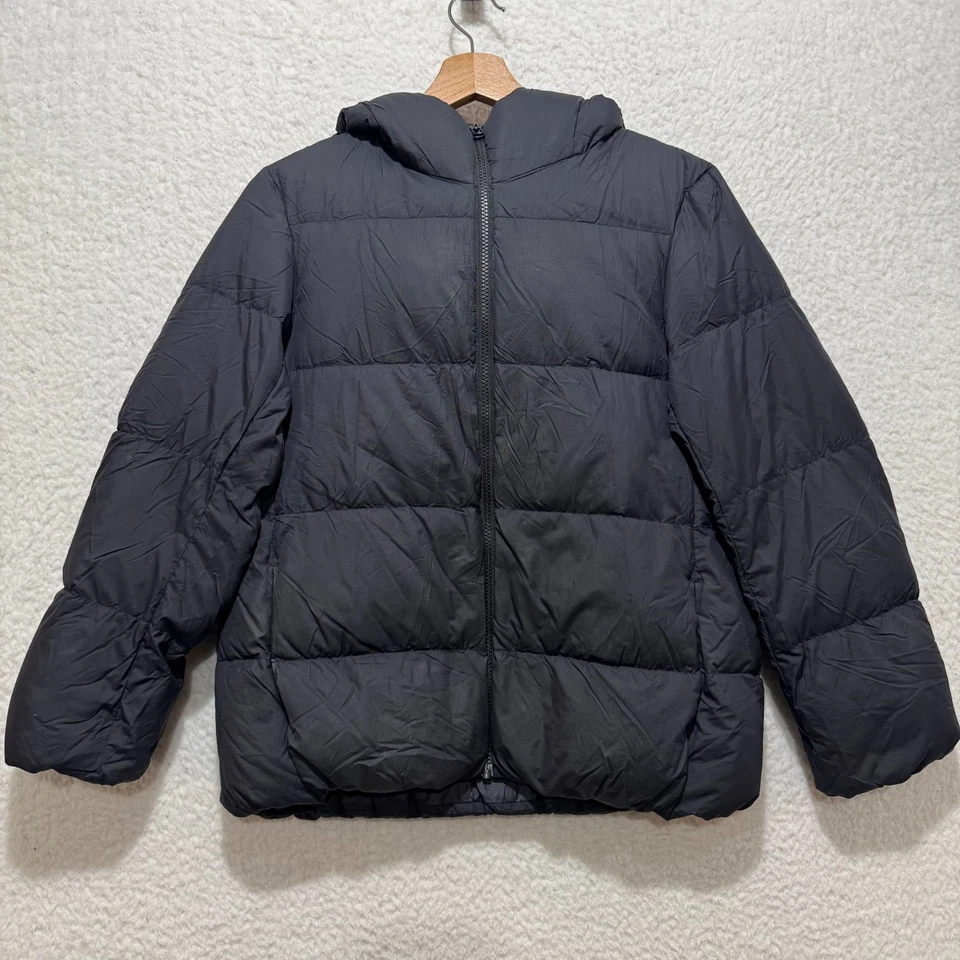 Chaqueta acolchada UniQlo negra para mujer talla XS ultra ligera con cremallera completa repelente al agua Foto 1 de 4