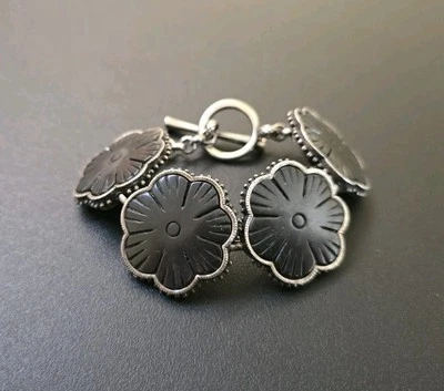 Pulsera flor madera marca Lucky Foto 1 de 4