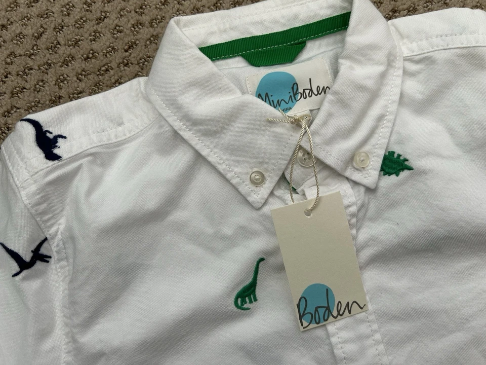 NUEVO CON ETIQUETAS Mini Boden Niños Blanco Algodón Dinasour Bordado Camisa de Vestir 9-10 años Foto 1 de 2