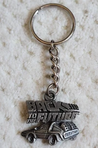 Vintage UCS BTTF Zurück in die Zukunft "OUTATIME" Delorean Zinn Schlüsselanhänger EUC - Bild 1 von 4