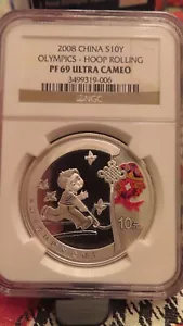 2008 China 1oz .999 Silver 10 Yuan Olympic Hoop Rolling NGC PR69 - Picture 1 of 4