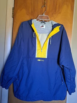 Chaqueta cortavientos/chaqueta para mujer Nike 1/4 cremallera azul y amarillo. Talla L. Usado en excelente estado Foto 1 de 4