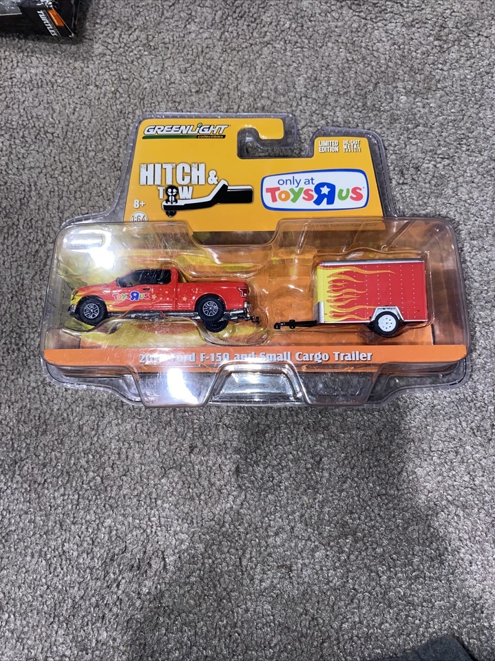 Greenlight Hitch & Tow 2015 Ford F-150 and Small Cargo Trailer TOYS R US Only  - Image 1 of 1