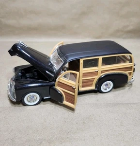 Welly 1948 Chevrolet Fleetmaster Woody Maßstab 1:24 schwarz Woodgrain Modellauto 2083 - Bild 1 von 8