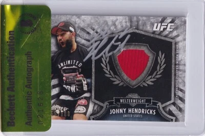 Tarjeta reliquia de luchador firmada por Johny Hendricks 2012 Topps UFC Bloodlines certificado de autenticidad FRJH BAS Foto 1 de 4