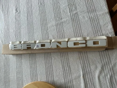 2021-2025 Ford Bronco Sport White Grille Nameplate Emblem Front OEM M1PZ-8A224-A - Image 1 of 3