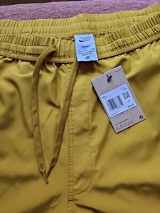 Neu Herren Nike DriFit Standard kurze Shorts Gr. 2XL Gold 7"  - Bild 1 von 5