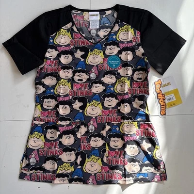 Blusa Médica Para Mujer Tooniforms Peanuts Love Stinks Cuello en V XS TF632 Foto 1 de 4