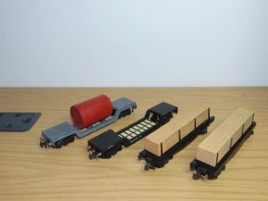 BT461: Trix Twin Railways Freight wagons x 4 - Weltrol with Load & Timber Wagons - Picture 1 of 3
