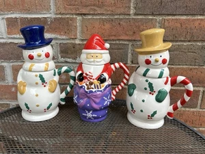 Set Of 3 Temptations 24oz Figure Hot Cocoa Mugs w Tops Santa 2 Snowmen Ovenware - Picture 1 of 13