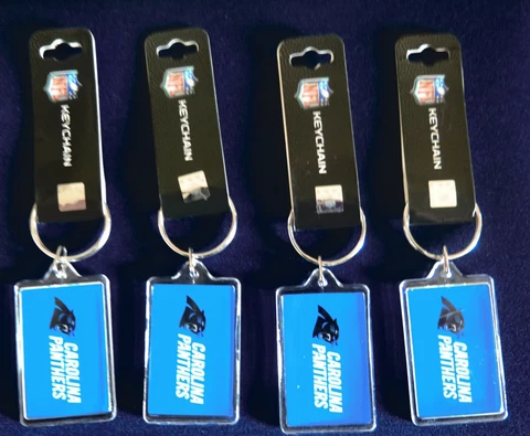 FOUR (4) CAROLINA PANTHERS ACRYLIC KEY RINGS FROM PRO SPECIALTIES Cover