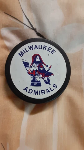 Mid 80's Milwaukee Admirals (IHL) Captain Crunch logo official game used puck Cover