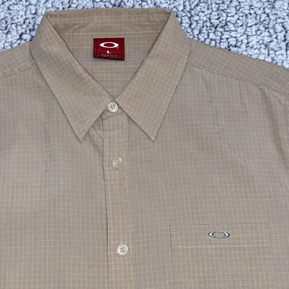 Vintage Oakley Tan Sand Plaid Button Up Plaid Short Sleeve Tech Camp Shirt - Image 1 of 4