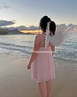 Costume blanc pour enfants plumes ailes d'ange pointant vers le haut ou vers le bas
