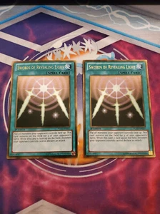 Yugioh - Swords of Revealing Light PGLD-EN057 LP/NM 1st ed Gold Rare x2 - Picture 1 of 1