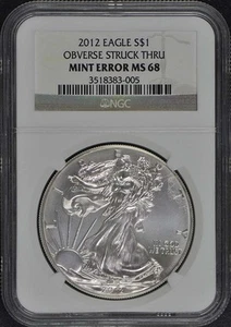 2012 $1 Silver Eagle Mint Error Obverse Struck Thru NGC MS68 - Picture 1 of 4