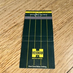 Vintage HEKMAN OF GRAND RAPIDS Matchbook Cover TABLES OF MERIT - Picture 1 of 3