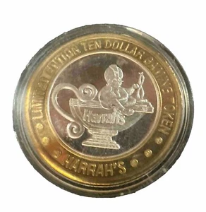 Harrah's $10 Silver strike 0.999, Reno NV. casino token. Genie  (D) - Picture 1 of 2